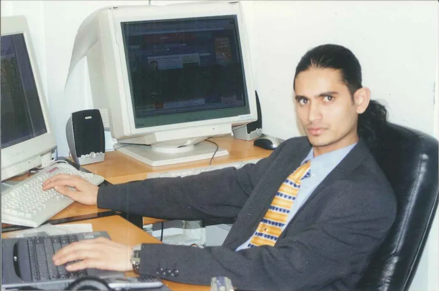 Naushad at a workstation in the late 1990s office.